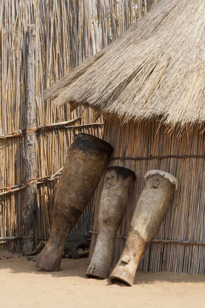 Wall Art Painting id:130517, Name: Namibia, Caprivi Strip Tribal drums lean on hut, Artist: Kaveney, Wendy