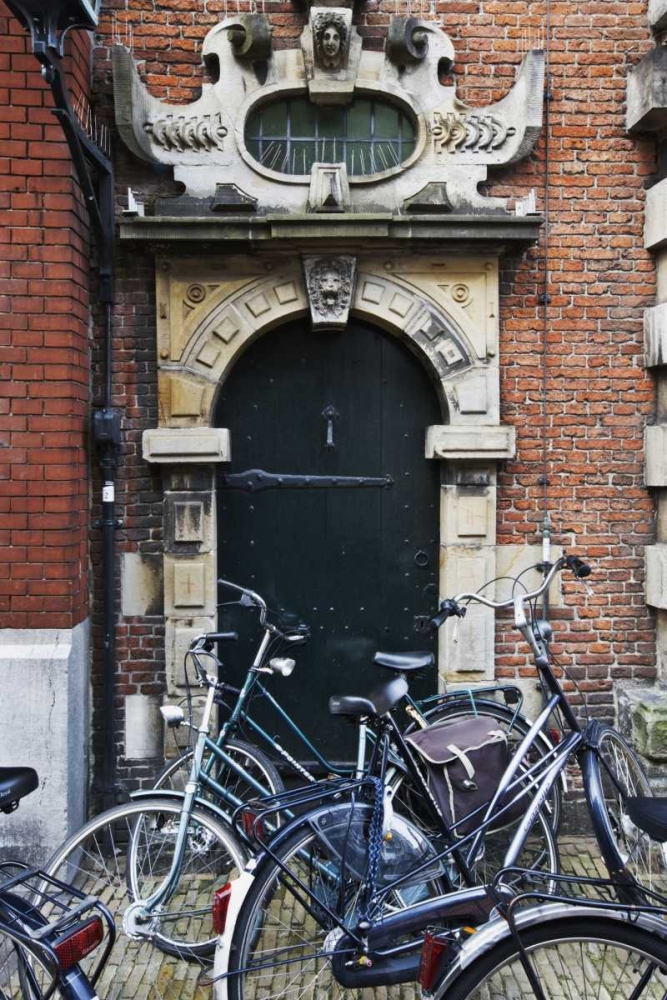 Wall Art Painting id:128095, Name: Netherlands, Amsterdam Bicycles by building door, Artist: Flaherty, Dennis