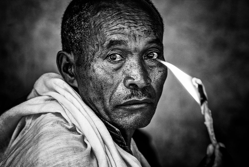 Wall Art Painting id:508564, Name: Ethiopian Man Holding A Lit Candle In A Religious Ceremony., Artist: Inazio Kuesta, Joxe